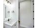 Modern bathroom with a lighted mirror, white countertop, and sleek black faucet at 2160 7Th Ave, Deland, FL 32724