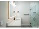 Elegant bathroom boasts a lighted mirror, modern fixtures, and a glass-enclosed shower with tile at 2160 7Th Ave, Deland, FL 32724