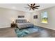 Inviting bedroom features a ceiling fan, stylish rug, and a picturesque window view at 2160 7Th Ave, Deland, FL 32724
