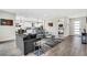 Comfortable living room flows into the modern kitchen, featuring stylish decor and ample natural light at 2160 7Th Ave, Deland, FL 32724