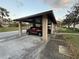 Carport parking with covered parking spaces and neatly maintained common grounds at 2284 Firestone Pl, Winter Haven, FL 33884