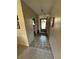 Welcoming entryway with neutral tile flooring and a decorative wreath on the front door at 2284 Firestone Pl, Winter Haven, FL 33884
