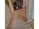 Hallway featuring tile flooring, carpet and decorative accents leading into the home at 2284 Firestone Pl, Winter Haven, FL 33884