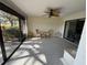 Enclosed patio with a ceiling fan and outdoor seating offering a relaxing space with a view at 2284 Firestone Pl, Winter Haven, FL 33884