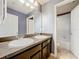 Bathroom featuring double sinks and dark brown cabinetry, providing ample counter space at 2805 Polson Dr, Kissimmee, FL 34758