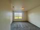 Bedroom with neutral walls, carpet, and window views at 2946 Ashland S Ln, Kissimmee, FL 34741