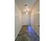 Home entryway with tile flooring and a decorative front door at 2946 Ashland S Ln, Kissimmee, FL 34741