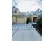 Townhome with attached garage and covered entryway at 2946 Ashland S Ln, Kissimmee, FL 34741