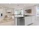 Open kitchen layout featuring an island with stainless appliances connecting to the living area at 3626 Cambridge Brook Dr, Davenport, FL 33837