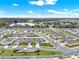 New single Gathering homes feature lush lawns, sidewalks and are located on a cul-de-sac street near a lake at 425 Singing Sands Cir, Lake Wales, FL 33859