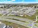 An aerial view showcases this neighborhood's layout and landscaping at 425 Singing Sands Cir, Lake Wales, FL 33859