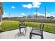 Relax in this backyard with patio, chairs and privacy fence at 425 Singing Sands Cir, Lake Wales, FL 33859