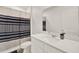 Bathroom featuring a shower, toilet, vanity with a countertop and sink, and mirror at 425 Singing Sands Cir, Lake Wales, FL 33859