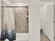 Bathroom featuring a tiled shower with a shower curtain and a separate toilet area at 425 Singing Sands Cir, Lake Wales, FL 33859