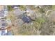 Aerial shot of roof with solar panels and mature trees on a large lot at 432 Wilderness Dr, Longwood, FL 32779