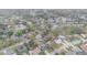 Sprawling aerial view of the neighborhood with mature trees, beautiful homes, and blue swimming pools at 432 Wilderness Dr, Longwood, FL 32779