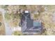 Aerial view of home with solar panels and screened pool, nestled among mature trees in established neighborhood at 432 Wilderness Dr, Longwood, FL 32779