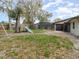 Backyard with a screened-in pool, playground, lush greenery, and patio area at 432 Wilderness Dr, Longwood, FL 32779