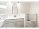 Bathroom features stylish vanity, arched mirror, and charming tiled dog-washing station at 432 Wilderness Dr, Longwood, FL 32779