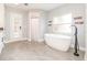 Bright bathroom featuring a modern soaking tub, sleek fixtures, and natural light at 432 Wilderness Dr, Longwood, FL 32779