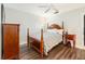 Charming bedroom with four poster bed, dark wood furniture and hardwood floors at 432 Wilderness Dr, Longwood, FL 32779