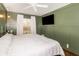A spacious bedroom with a large window and a comfortable king-size bed at 432 Wilderness Dr, Longwood, FL 32779