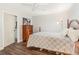 Relaxing bedroom with hardwood floors, neutral colors, and ample natural light at 432 Wilderness Dr, Longwood, FL 32779