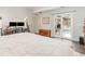Cozy bedroom with sliding glass doors to pool, hardwood floors, and natural light at 432 Wilderness Dr, Longwood, FL 32779