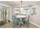 Cozy breakfast nook with tile floors, a modern light fixture, and a view to the backyard at 432 Wilderness Dr, Longwood, FL 32779