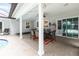 A covered patio featuring tile flooring, a dining table, and views of the pool at 432 Wilderness Dr, Longwood, FL 32779