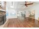 Sun room featuring hardwood floors, a skylight, and a brick fireplace at 432 Wilderness Dr, Longwood, FL 32779