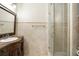 Bathroom featuring a glass shower, granite countertop vanity, and tile flooring at 5138 Fairway Oaks Dr, Windermere, FL 34786