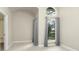 Sunlit bedroom with a large window and neutral walls with curtains at 5138 Fairway Oaks Dr, Windermere, FL 34786