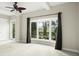 Large bedroom featuring a bay window with backyard views and a ceiling fan at 5138 Fairway Oaks Dr, Windermere, FL 34786