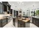 Spacious kitchen featuring two islands, custom cabinets, and stainless steel appliances at 5138 Fairway Oaks Dr, Windermere, FL 34786