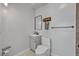 Modern bathroom with a vanity, toilet, mirror, towel rack, and tiled wall at 525 S Crystal Lake Dr, Orlando, FL 32803
