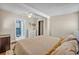 Comfortable bedroom featuring a queen-sized bed, white dresser, and access to ensuite bathroom at 525 S Crystal Lake Dr, Orlando, FL 32803