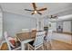 Well-lit dining area featuring hardwood floors, stylish light fixture and neutral paint at 525 S Crystal Lake Dr, Orlando, FL 32803