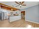 Updated kitchen featuring white cabinets, stainless steel appliances, a wood ceiling and hardwood floors at 525 S Crystal Lake Dr, Orlando, FL 32803