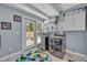 Bright laundry room with modern washer and dryer, outdoor access, and ample storage space at 525 S Crystal Lake Dr, Orlando, FL 32803