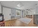 Bright living room with hardwood floors, neutral paint, and view to dining area at 525 S Crystal Lake Dr, Orlando, FL 32803