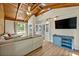 Spacious living room with hardwood floors, vaulted ceilings, and a comfortable sectional sofa at 525 S Crystal Lake Dr, Orlando, FL 32803