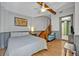 Comfortable bedroom with stairs to another room, neutral colors, and a side bathroom at 525 S Crystal Lake Dr, Orlando, FL 32803