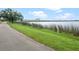 Paved walkway next to the water with a beautiful bridge spanning the expanse at 525 S Crystal Lake Dr, Orlando, FL 32803