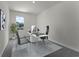 Home office featuring a modern desk, ergonomic chairs, and a bright window at 5614 Paddock Fence Ln, Apopka, FL 32712