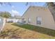 The backyard features a patio, grass, and a white fence, perfect for outdoor enjoyment and privacy at 615 Blue Park Rd, Orange City, FL 32763