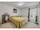 Cozy bedroom featuring a window and a comfortable bed at 615 Blue Park Rd, Orange City, FL 32763