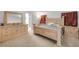 Spacious bedroom with large bed frame and matching dresser at 615 Blue Park Rd, Orange City, FL 32763