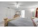 Bedroom with ceiling fan, neutral walls, and adjacent bathroom at 615 Blue Park Rd, Orange City, FL 32763