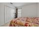 Comfortable bedroom with closet and a large window providing plenty of natural light at 615 Blue Park Rd, Orange City, FL 32763